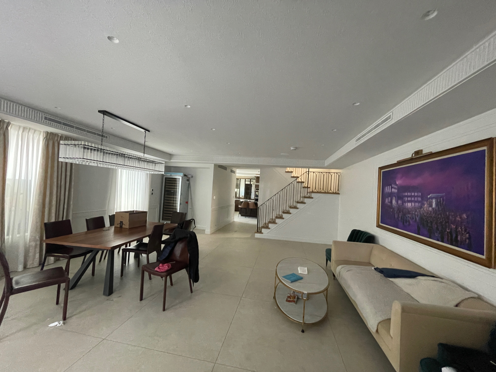 Duplex living room with concealed grilles
